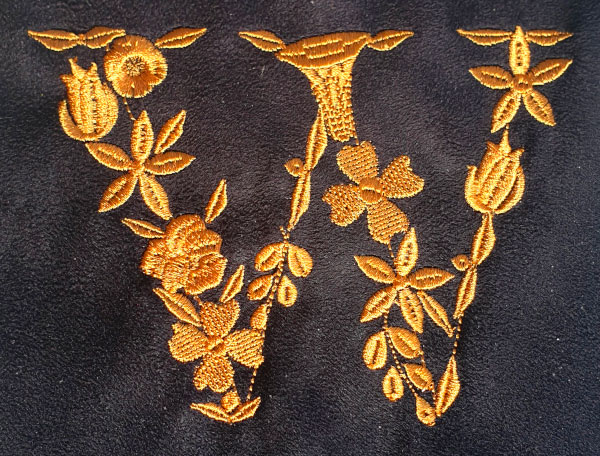 embroidered letter with various stitch types
